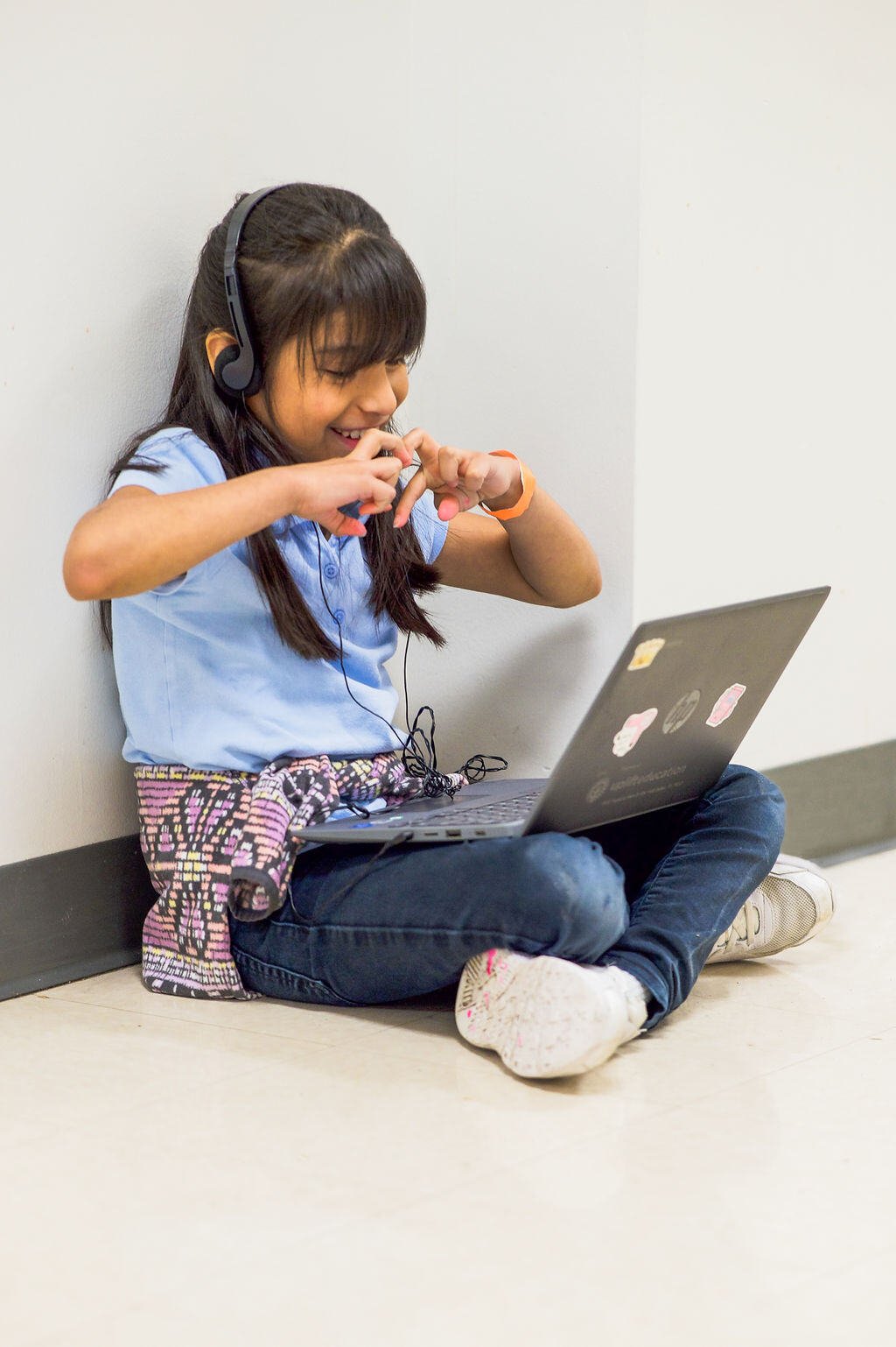 student in front of a computer being tutored virtually by OnYourMark student in front of a computer being tutored virtually by OnYourMark